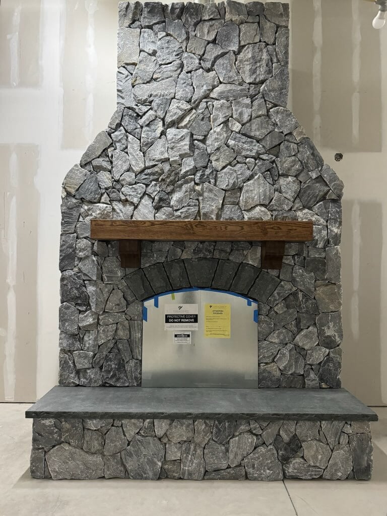 Delos-Coffee-Shop-1 Delos TerraForm Irregular Black and Grey Stone Cladding on a large fireplace