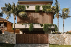 Sonoma exterior stone wall panels on a modern residence with tropical landscaping and a curved stone entry wall