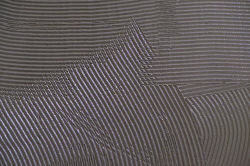 Tile thinset mud (also called cement) for a major tiling renovation project during a house renovation.