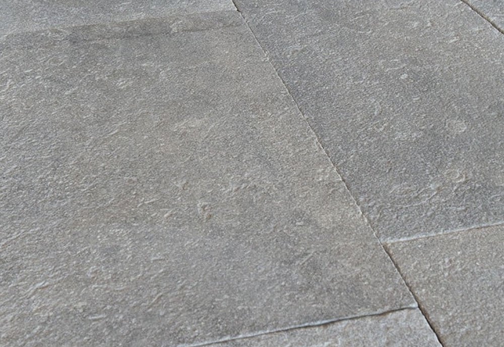 Ashford flamed and brushed natural stone tile flooring with a textured grey surface and large-format layout