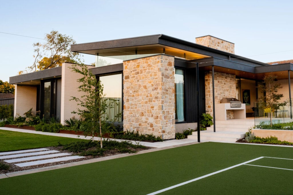 Harvest Gold Exterior Stone Veneer Siding on a Modern Home with Stone Siding on Walls Throughout