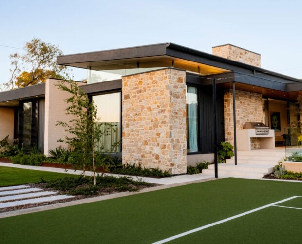 Harvest Gold Exterior Stone Veneer Siding on a Modern Home with Stone Siding on Walls Throughout
